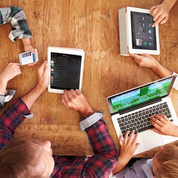 People At The Meeting Using A Device